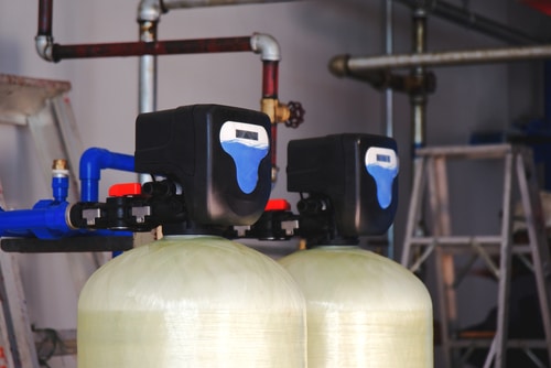 A water softener setup in a basement